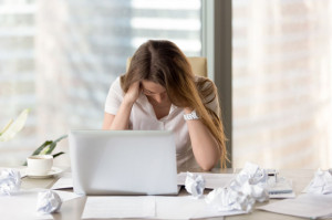 Stressed female entrepreneur in creativity crisis